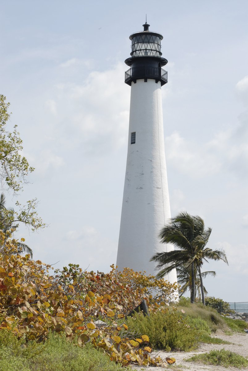 a light house is near a body of water