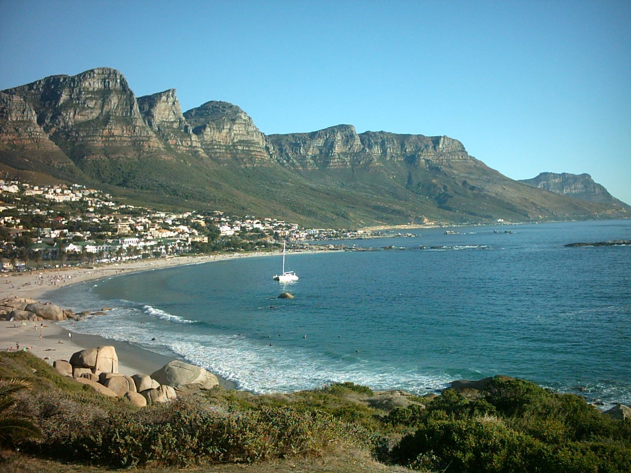 a beautiful view of an ocean and a hill range