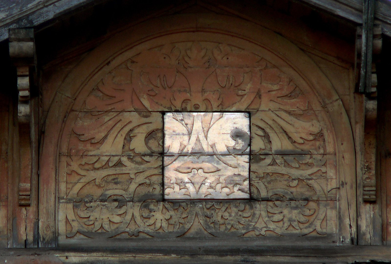 a building with an elaborate window with many carvings