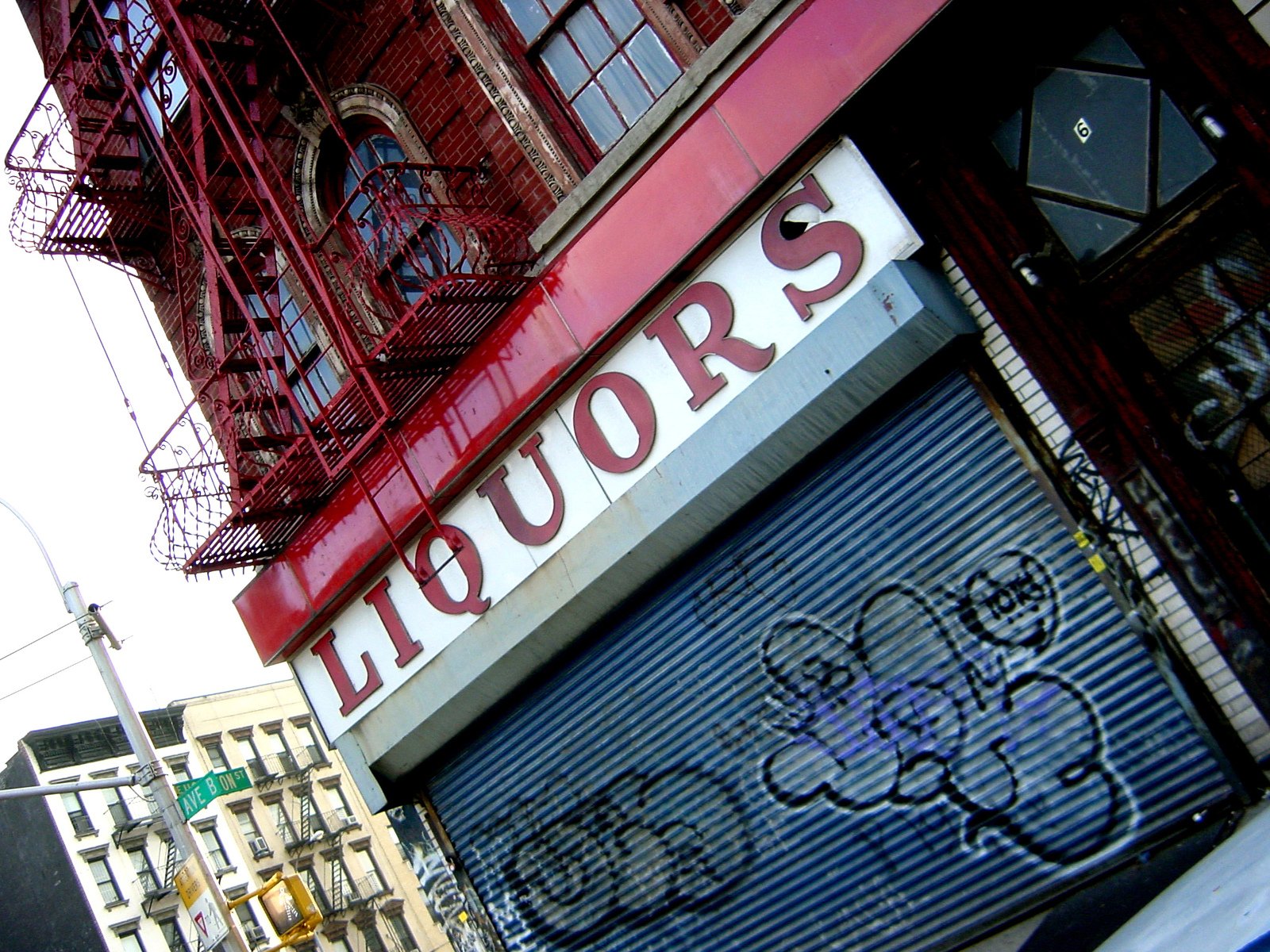 the signs above the storefront of liquors