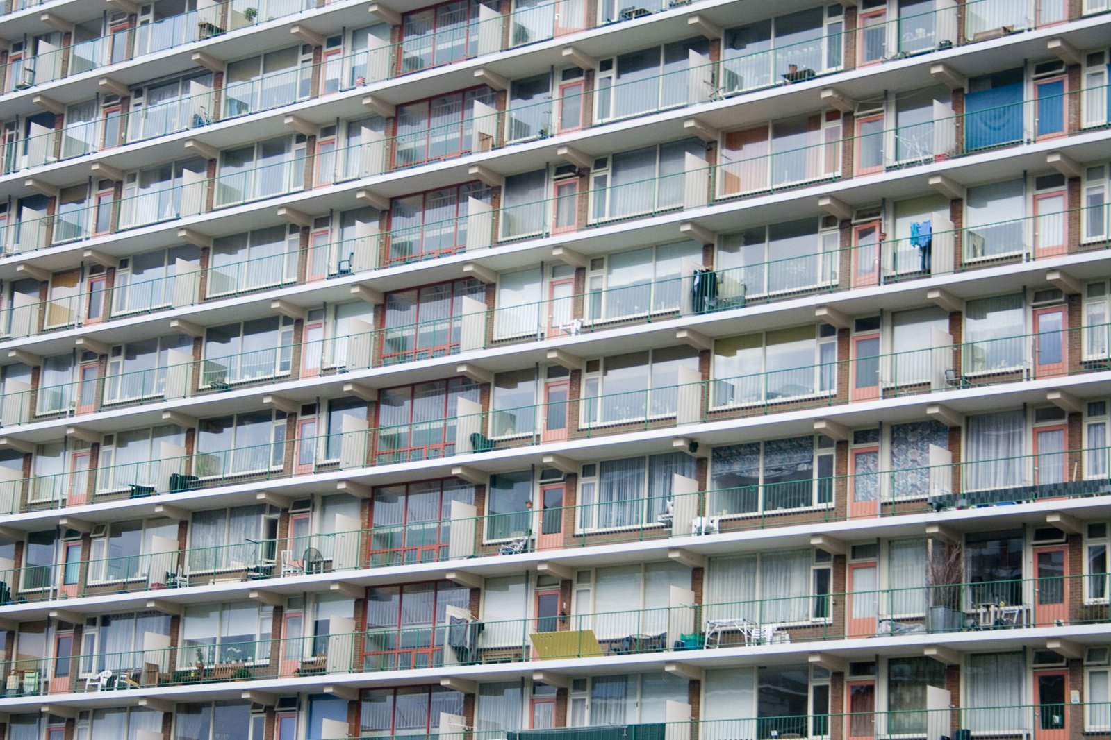 a multi - story apartment building is in the background