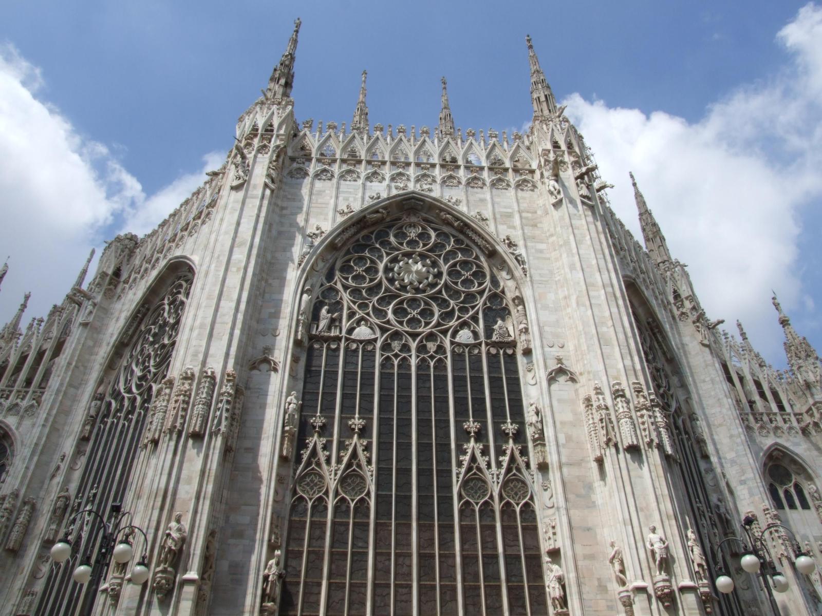 the massive cathedral has an ornate iron door