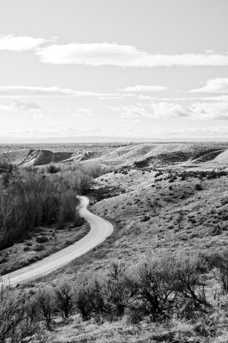 a black and white po of a country road