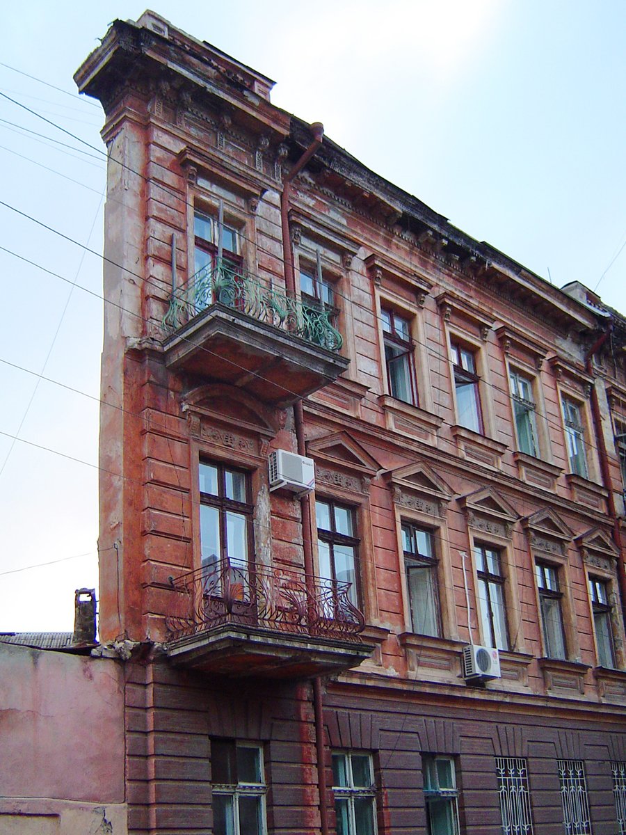 an old building with a lot of windows on the front