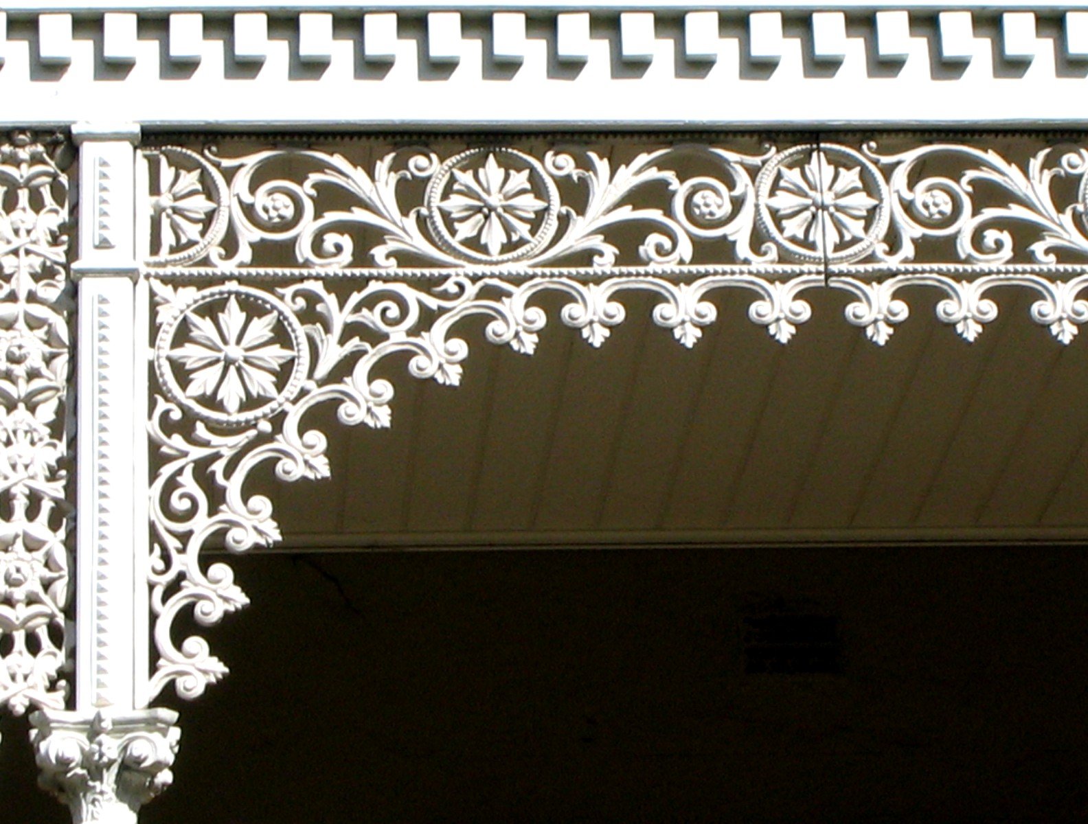 the ornate iron work on the side of a building