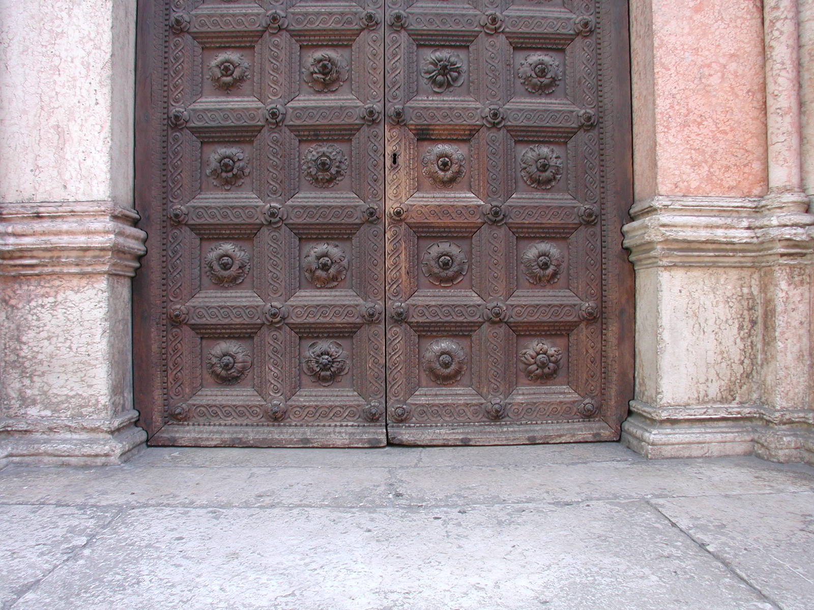 an old wooden door with carvings on it