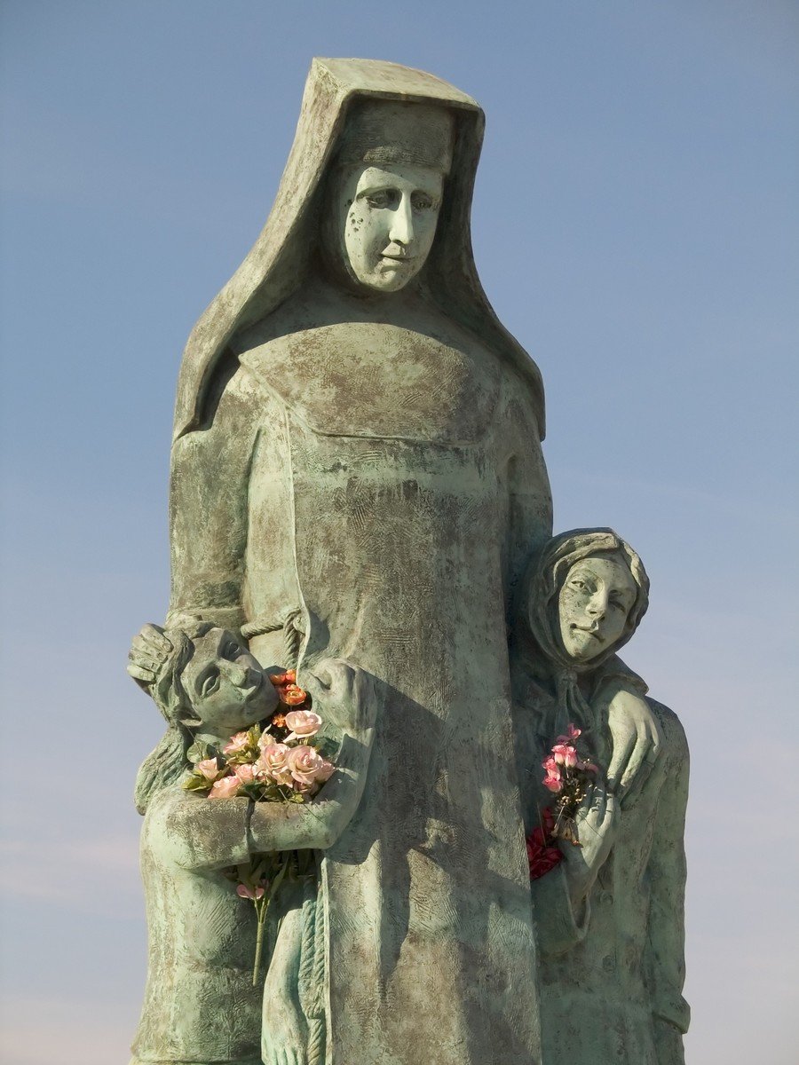 a statue with a woman holding a child