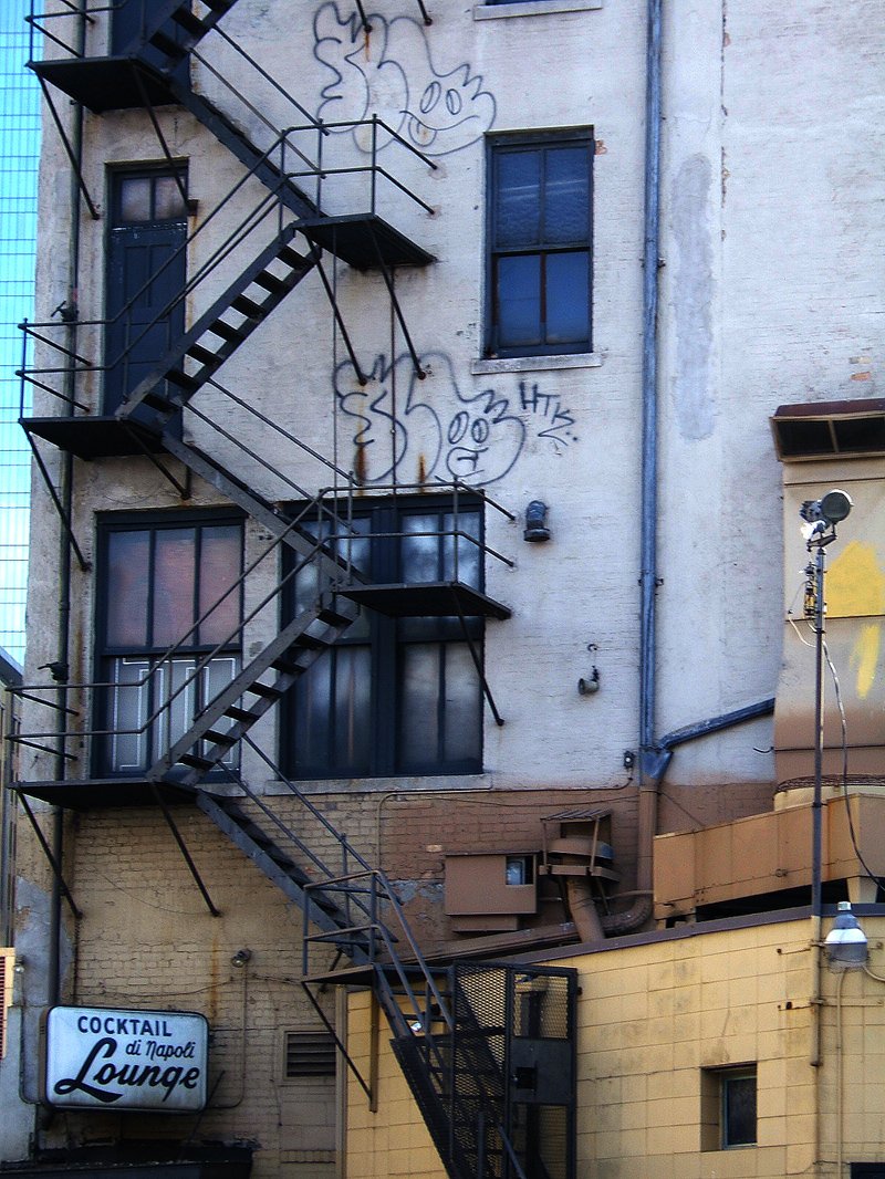 the stairs and graffiti on the building are going up