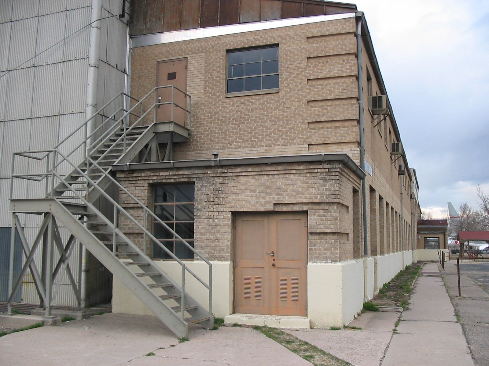 two fire escapes in the corner of a building with stairs