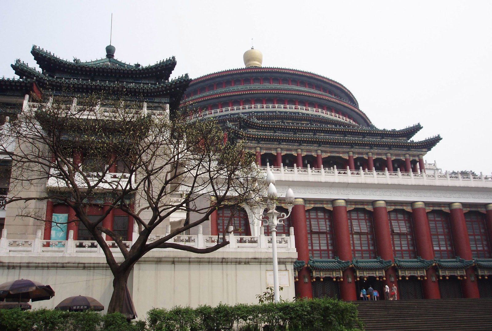 an asian building with a tree in front