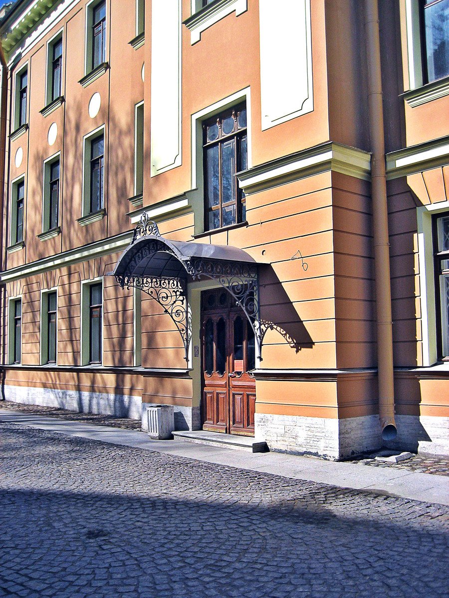 an old building with a clock tower on the corner