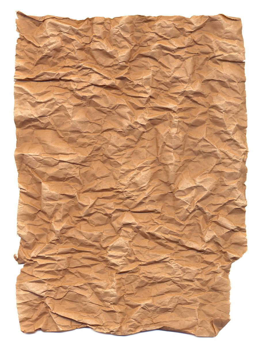 a very old, handmade brown paper with torn edges