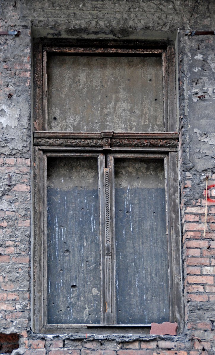 a window on a building that is brick