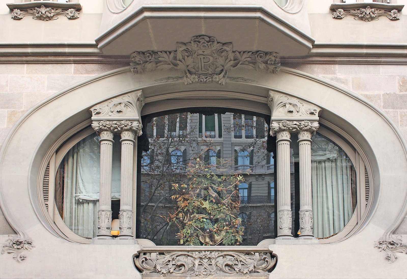 an elaborate entrance to a building with a clock on the side