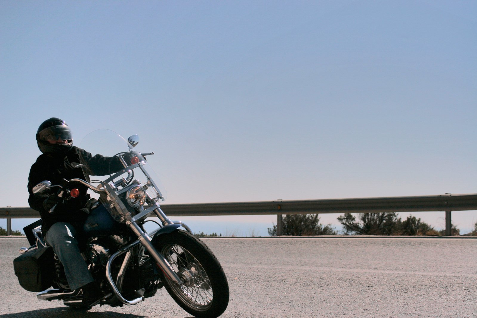 a man riding on the back of a motorcycle