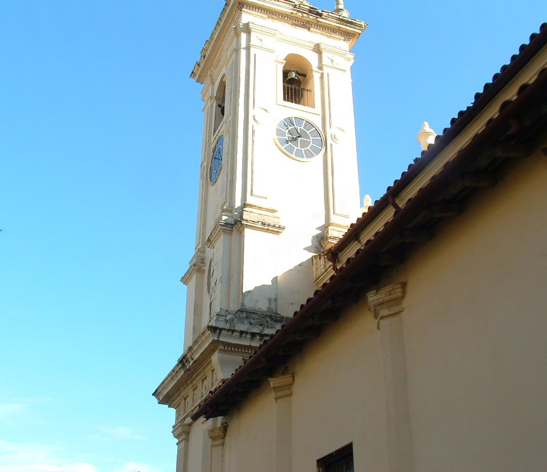 a clock is on the side of a building