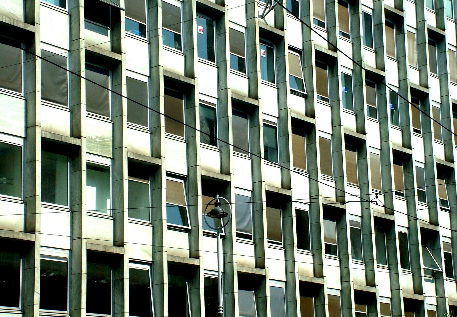 a large grey building with lots of windows