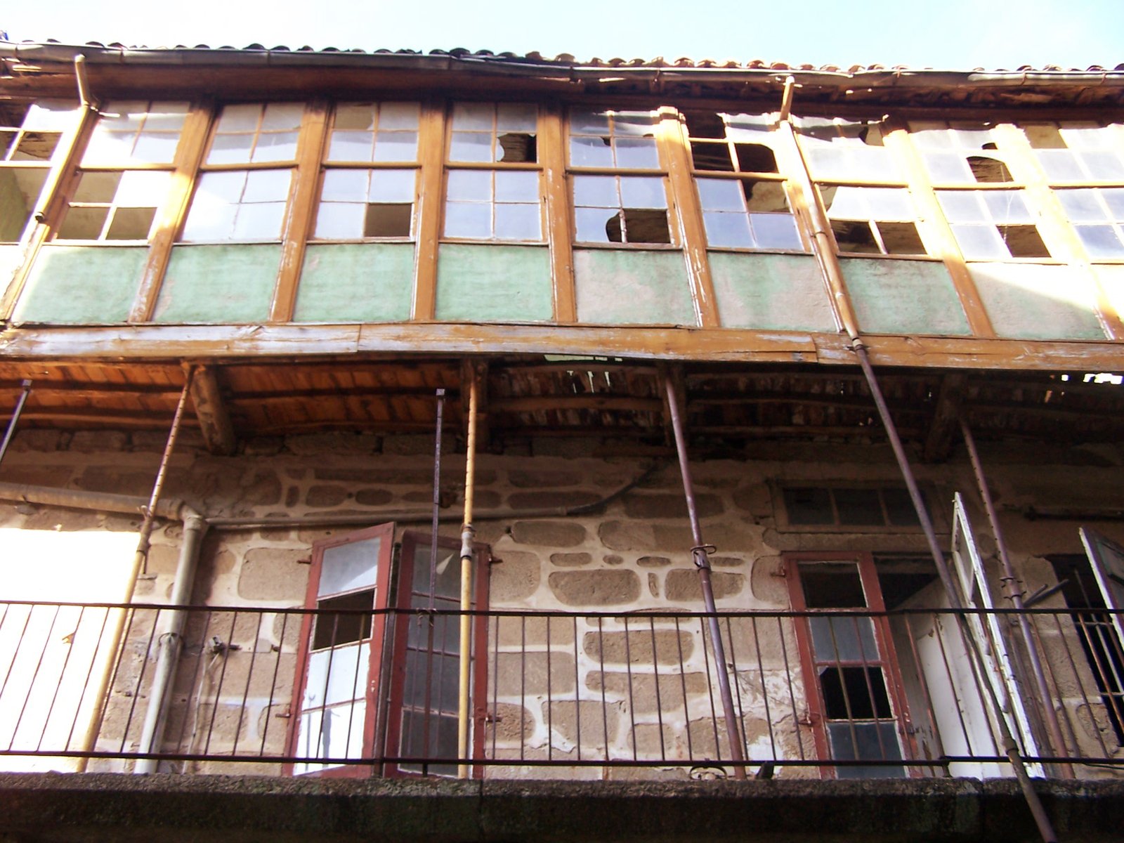 a picture of a very old house with big windows