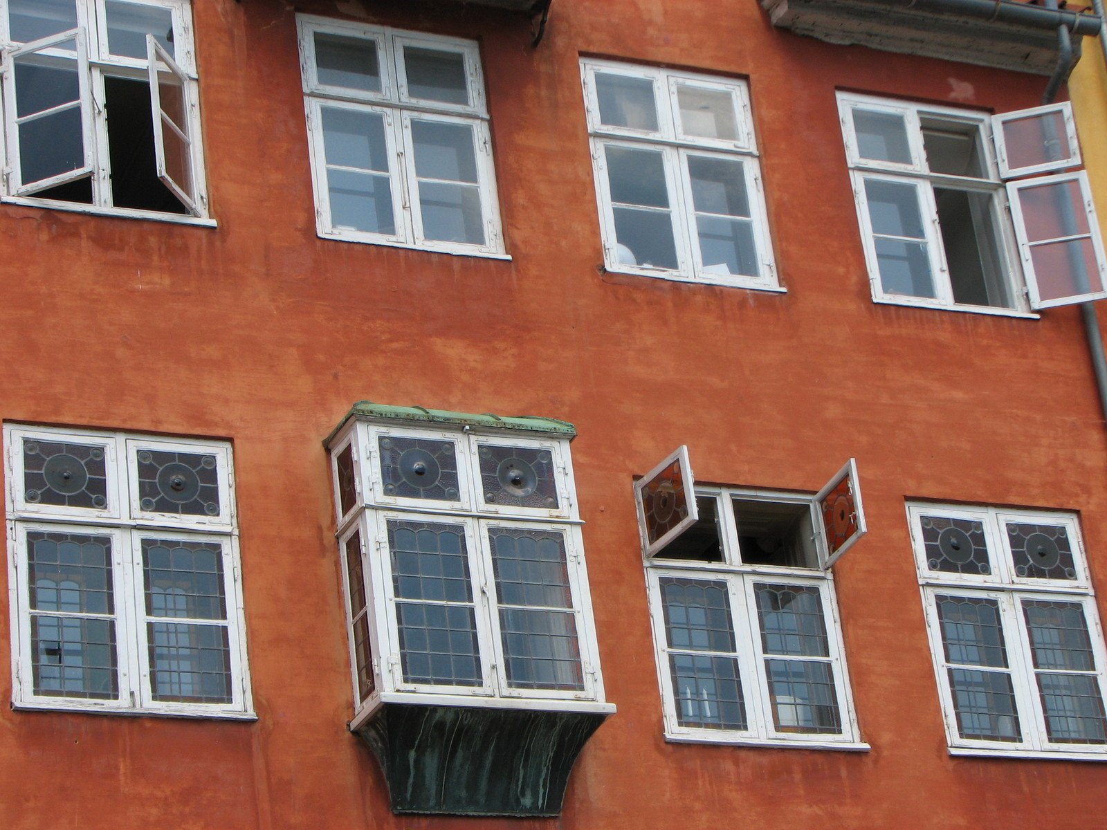 several windows in a building with no curtains on them