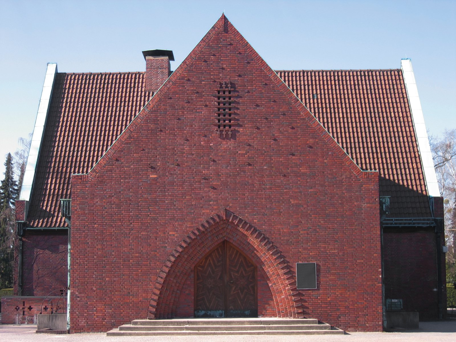 an old church with brick design with a steeple