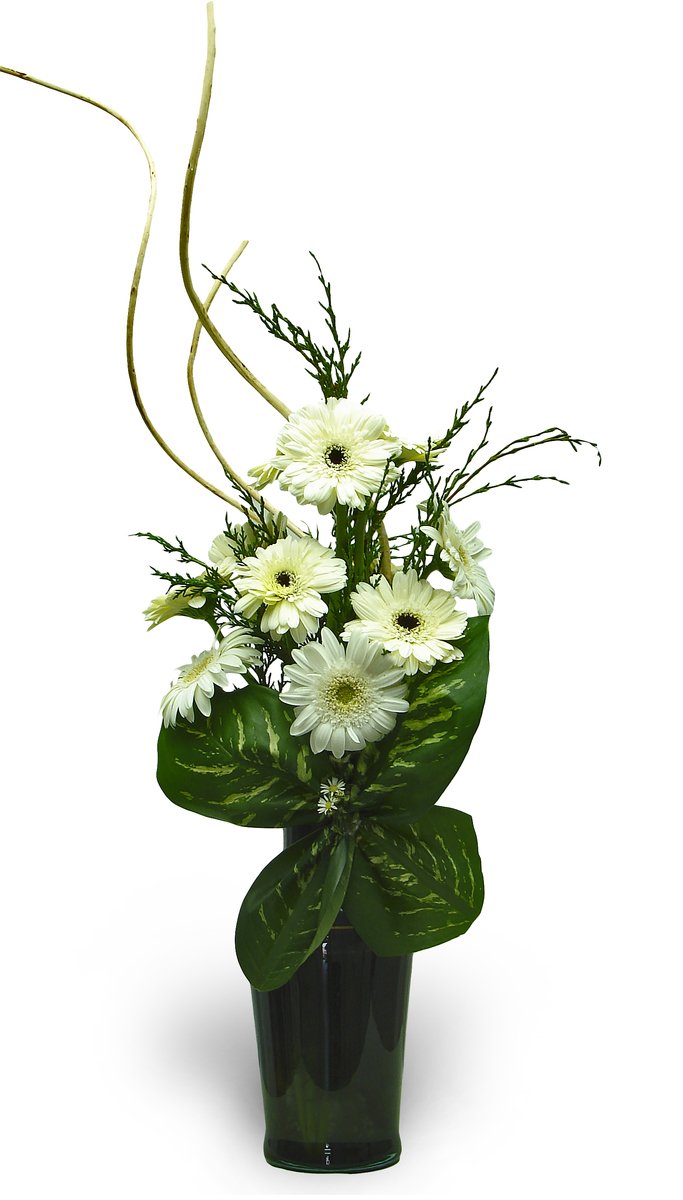 white flowers and greenery sitting in a black vase