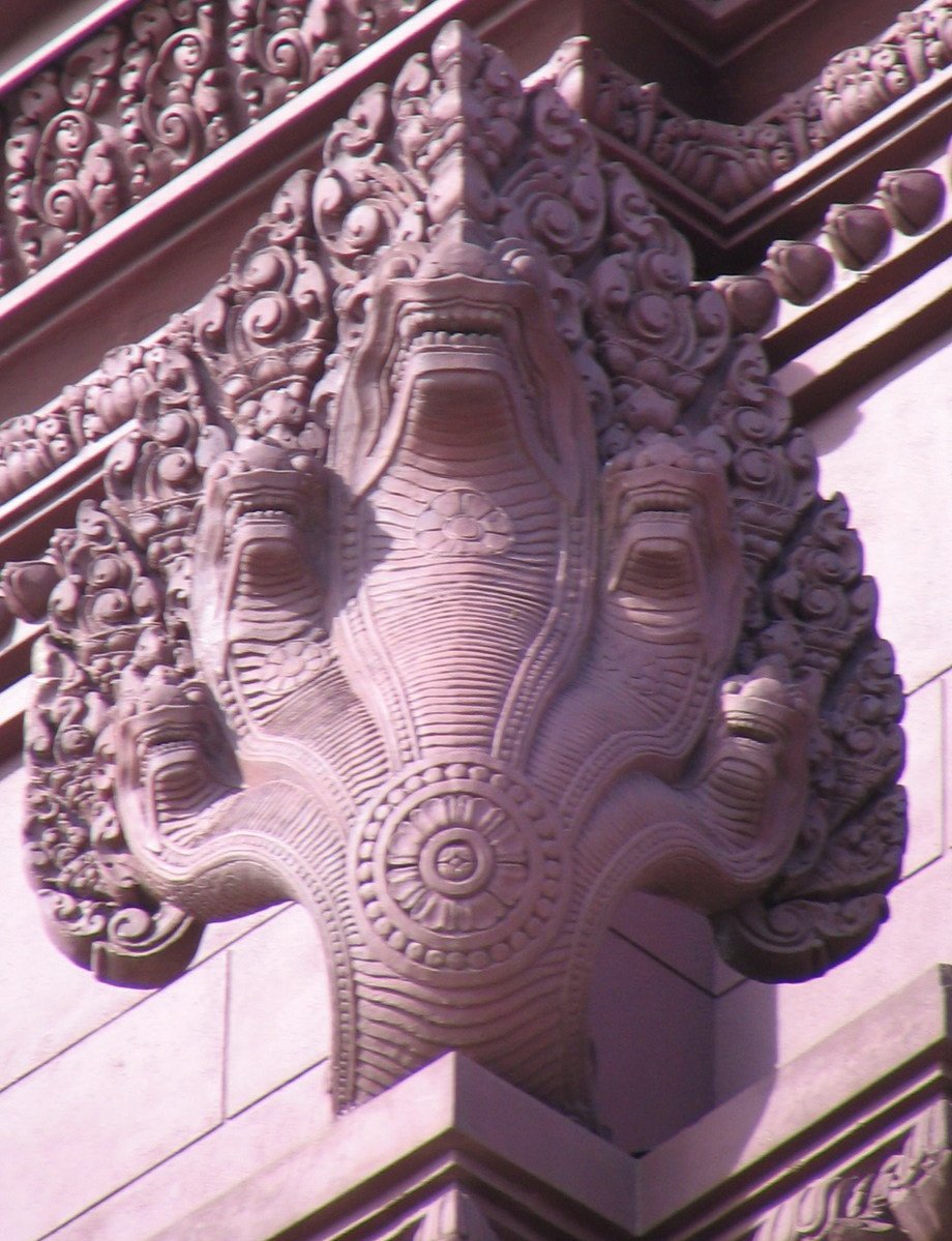 an ornate gargoyle in the center of a building