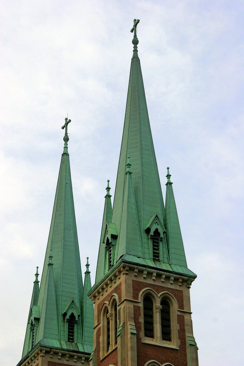 two towers of a church with sky in background