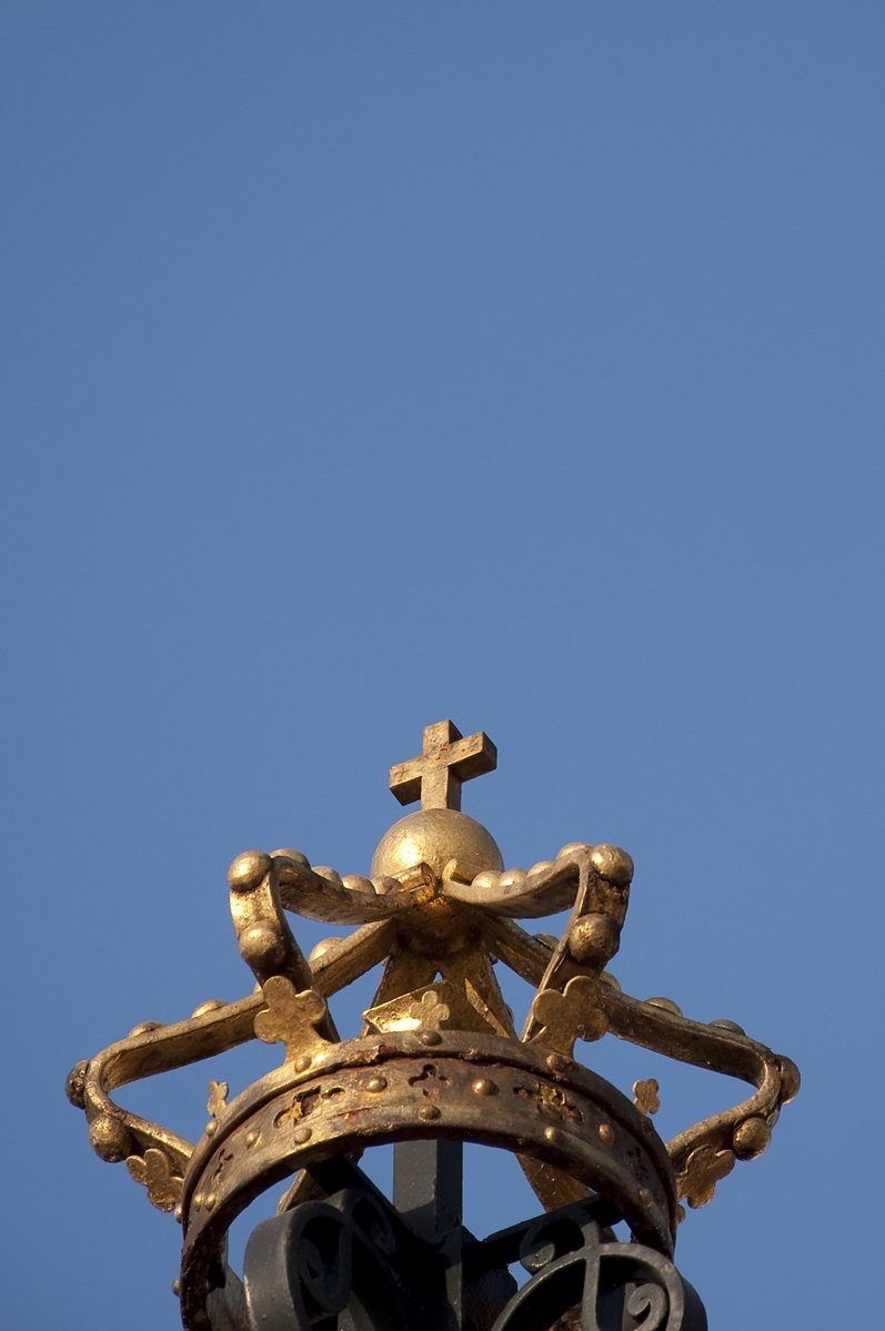 closeup of golden clock in a big tower