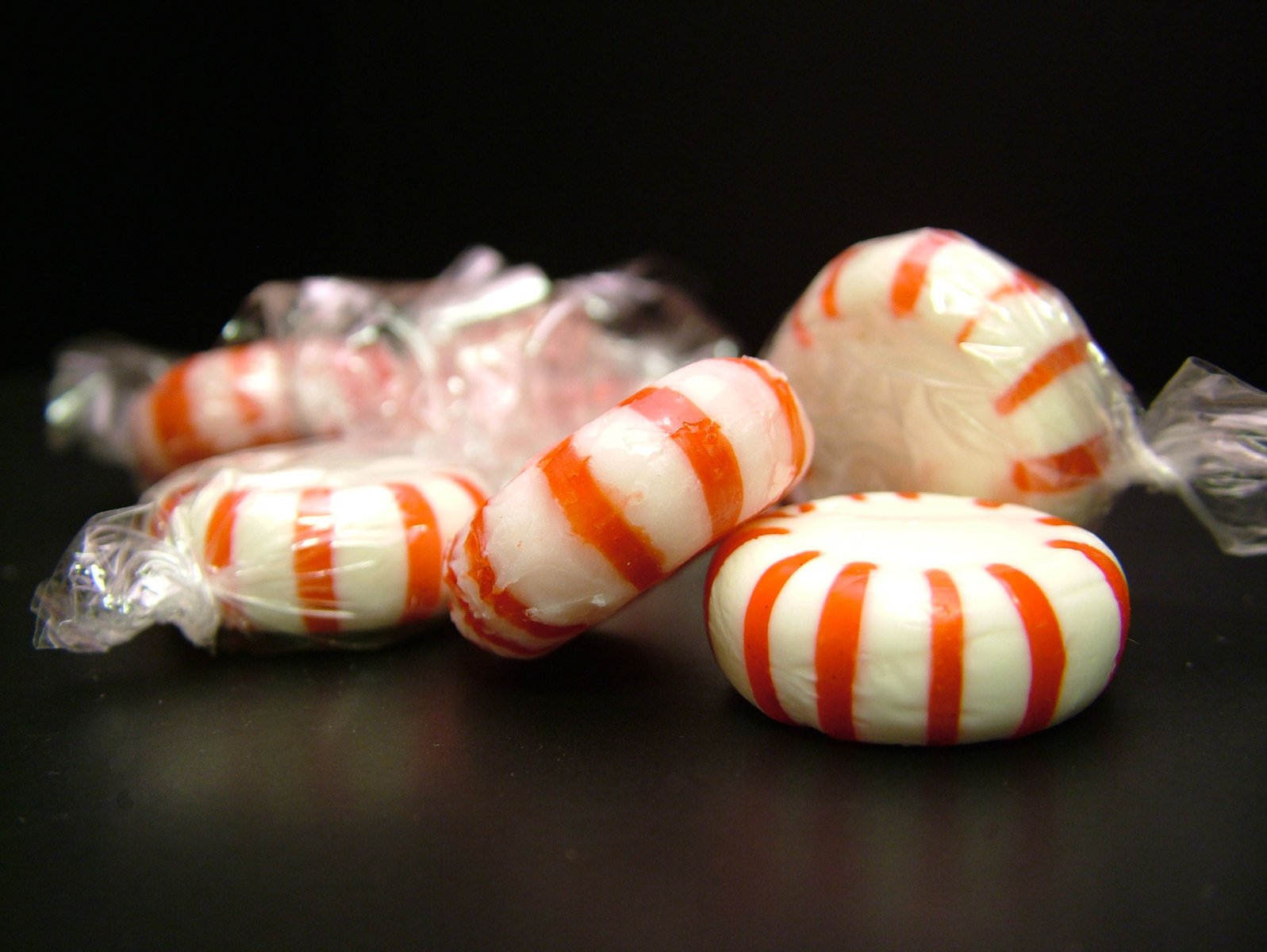 a pile of candy with a striped pattern on them