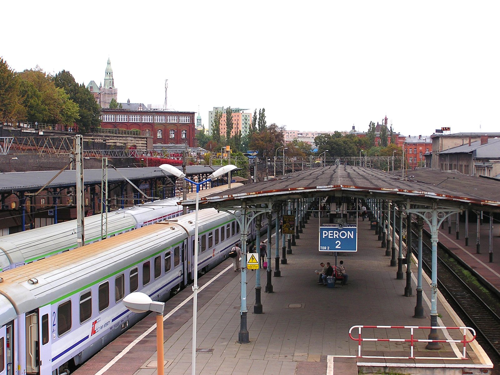 a train is parked on the train tracks in a station