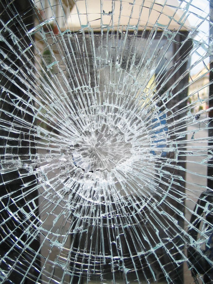 a window that has been broken with a glass