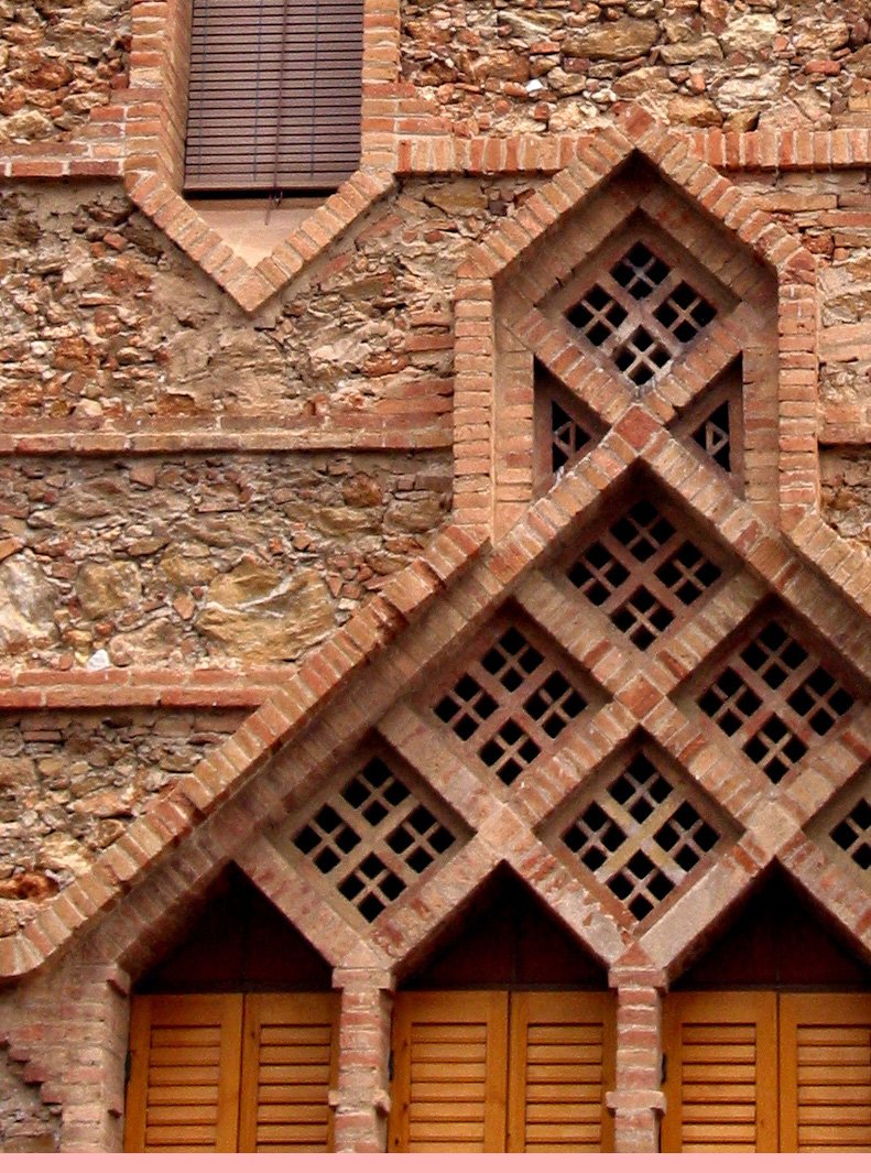 an abstract picture of two wooden doors in front of a brick wall