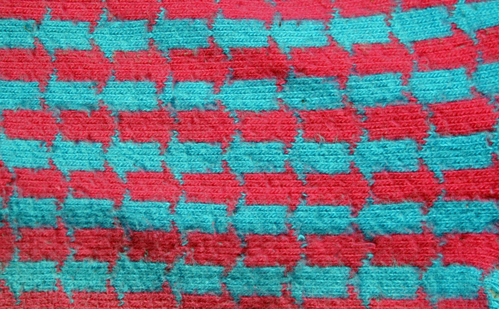 the blanket is blue, pink and red