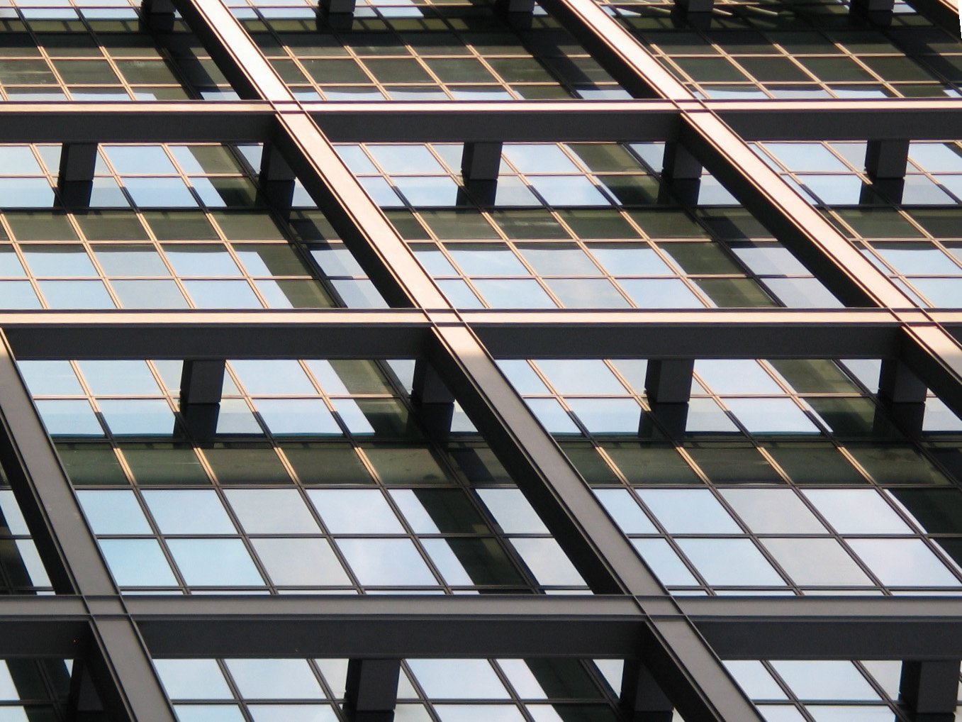 an image of a glass building in an urban setting