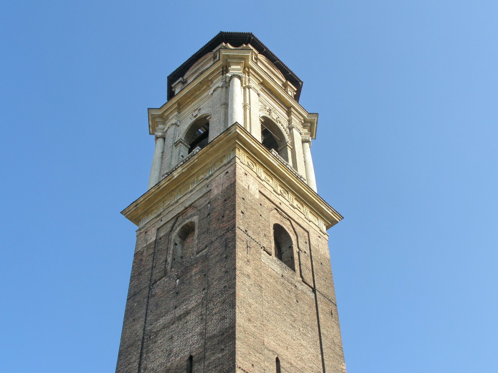 a tall tower in the sky with a small window