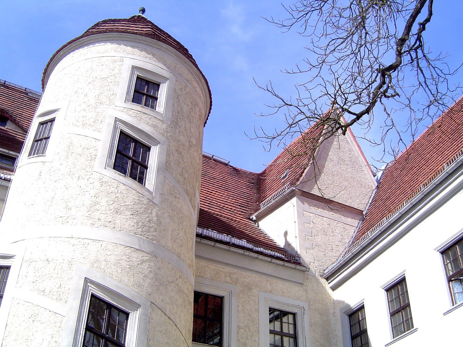 a very tall white building with lots of windows