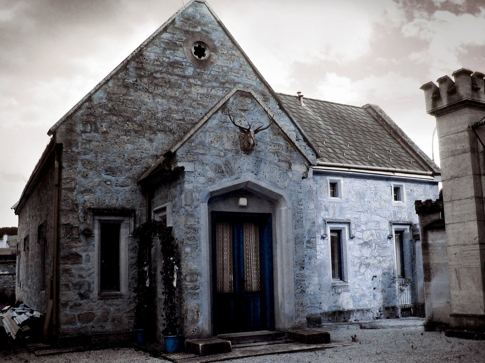 an old church building has two turrets on the roof