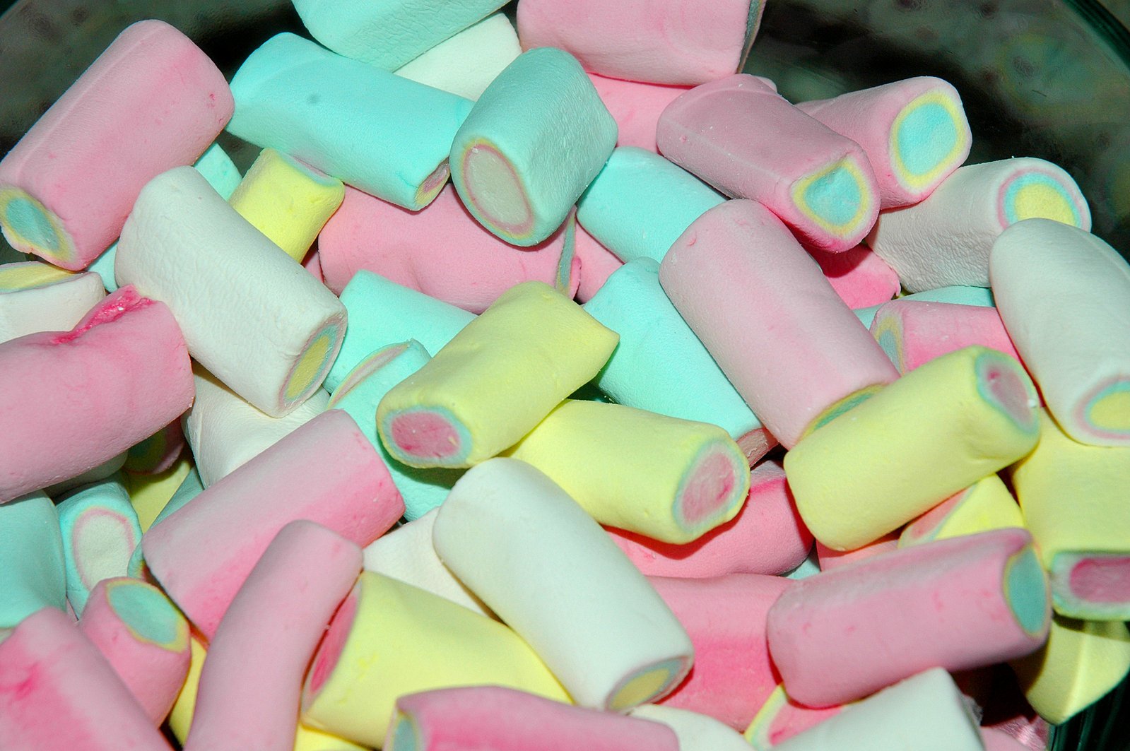 a pile of colorful candy shaped like candy bars