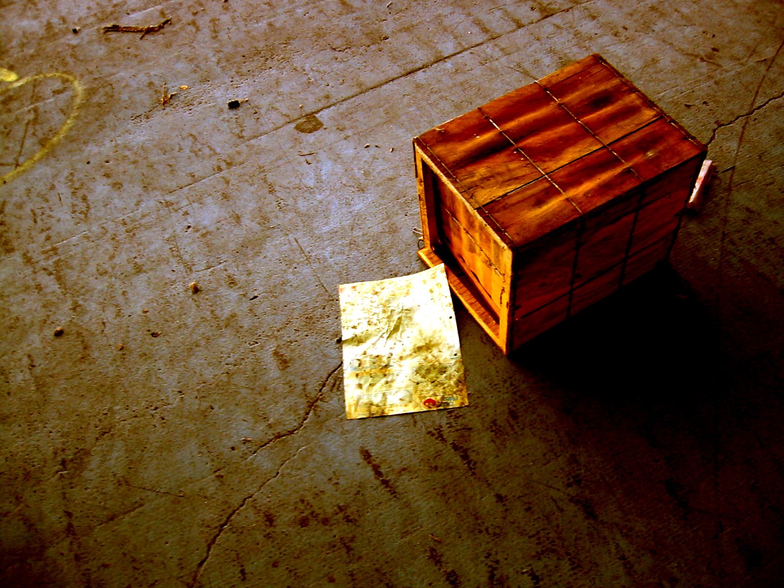 a wooden table sitting on top of a street