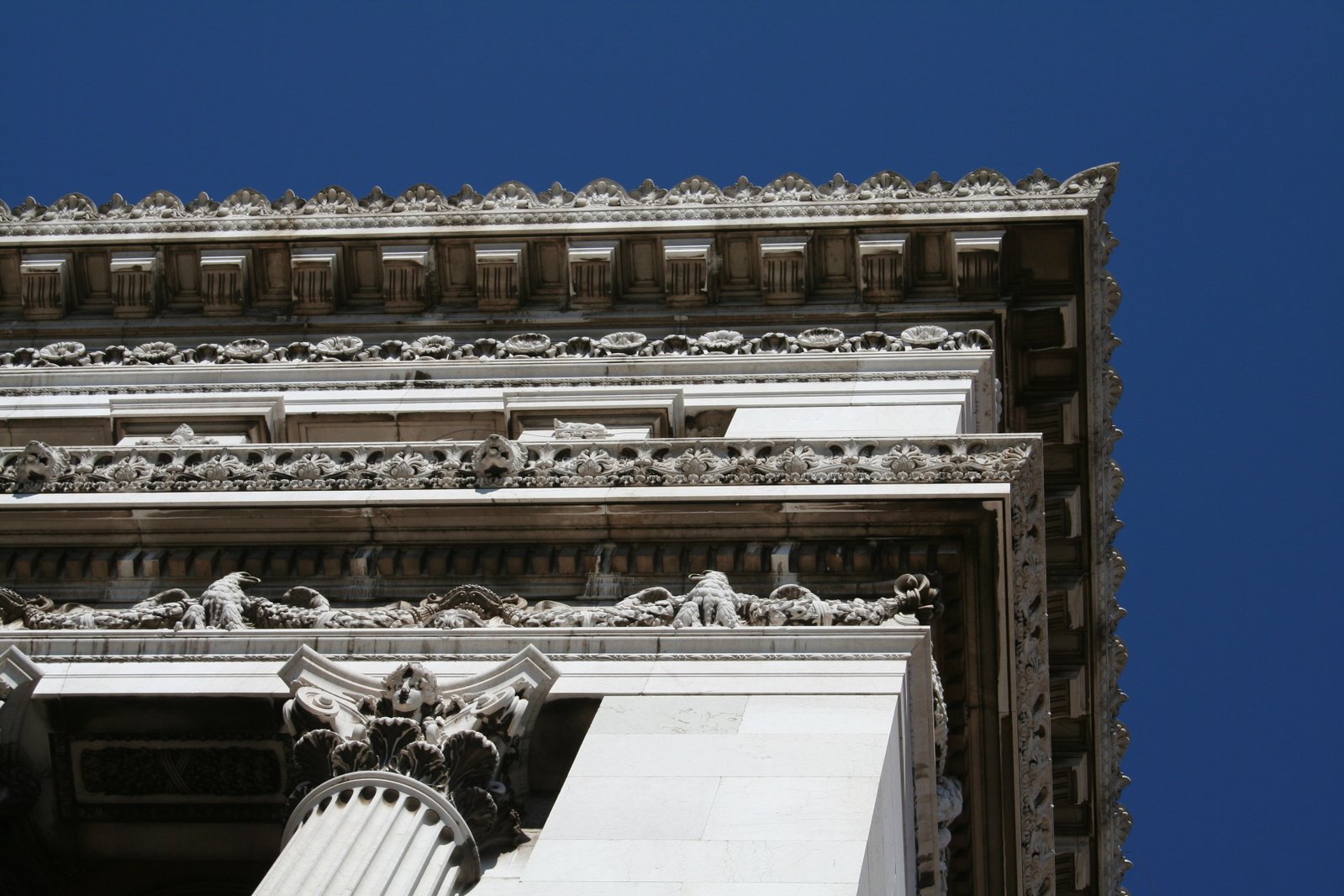 close up view of an intricate architecture, with a blue sky in the background