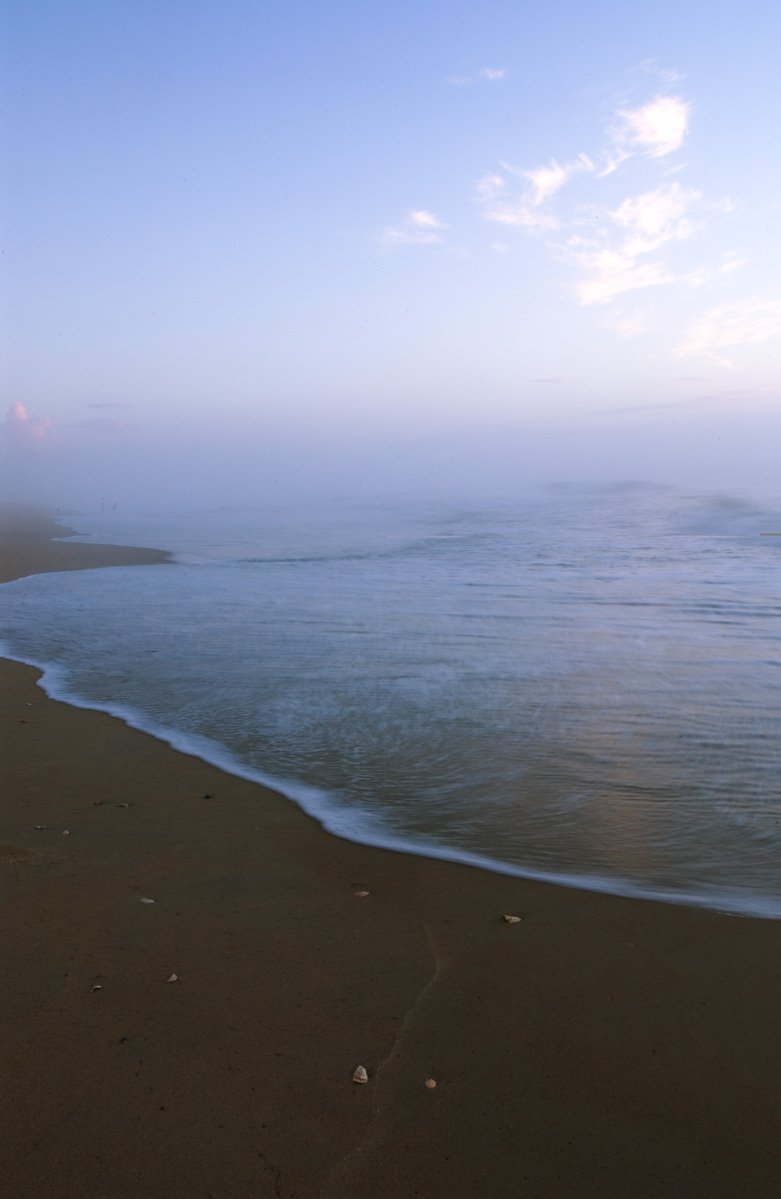 the ocean with the shore lines very empty