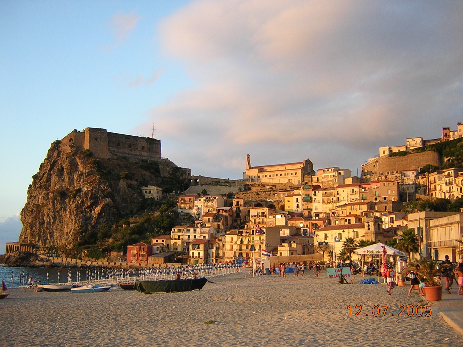 a beach area with several buildings built up above it