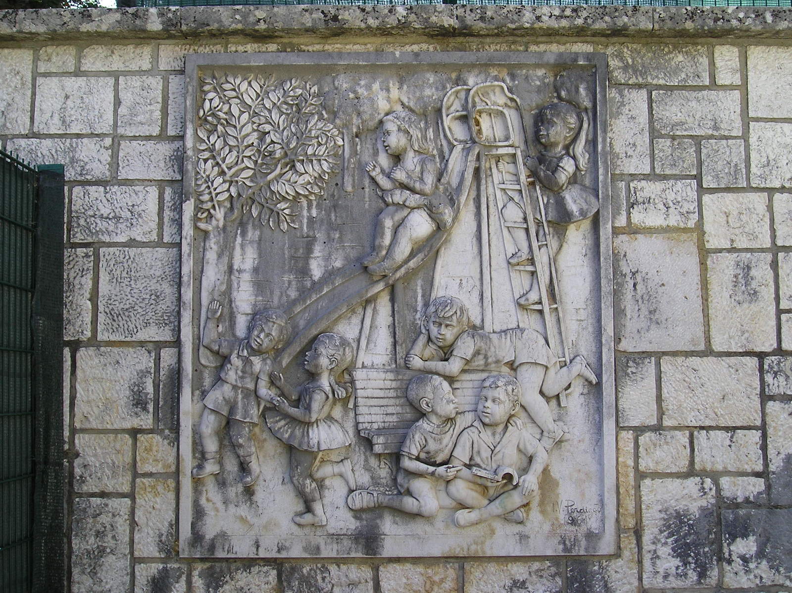 a relief depicting several people, such as an elephant, playing music
