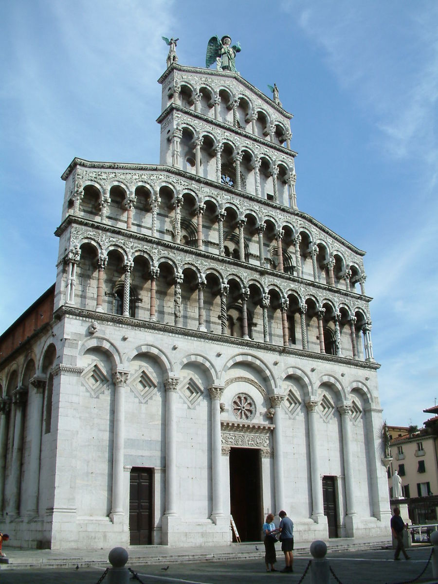 a tall cathedral with many arched windows is pictured