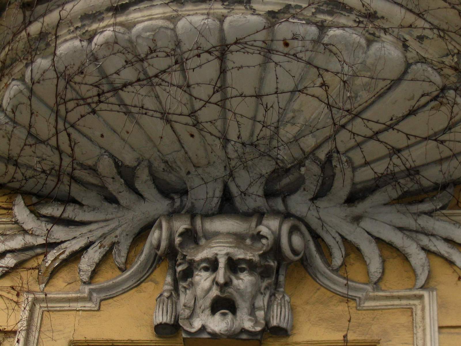 a gargoyle gargous adorns the building facade
