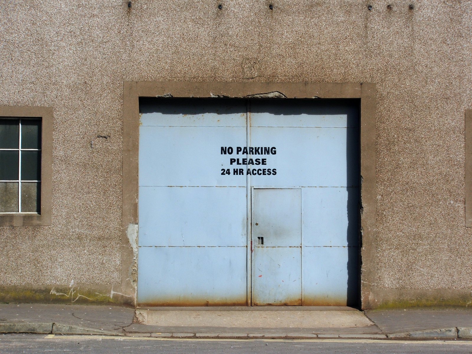 an image of the entrance to a building with a sign on it