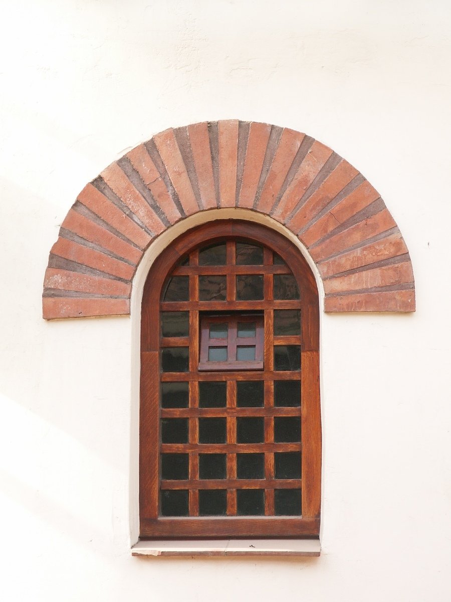 the small window is made from bricks and wood