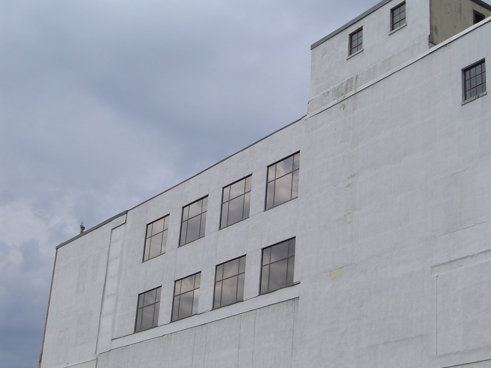 the bottom half of a building with four windows