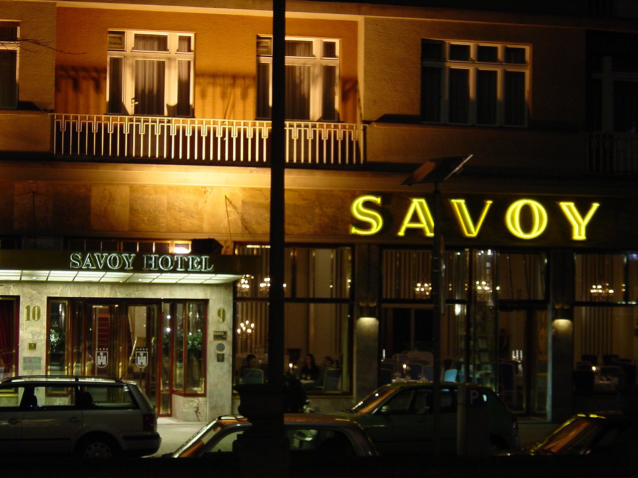 an image of a building that says savoy lit up at night