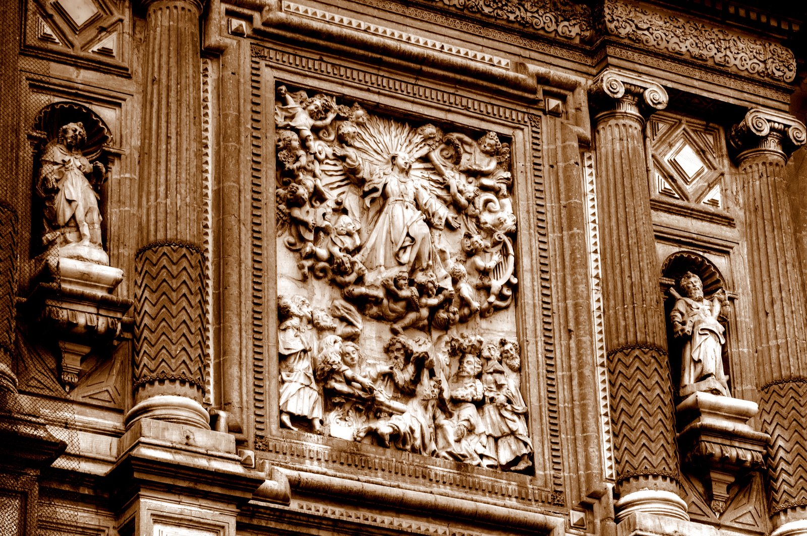 the large decorative panel on the side of a building